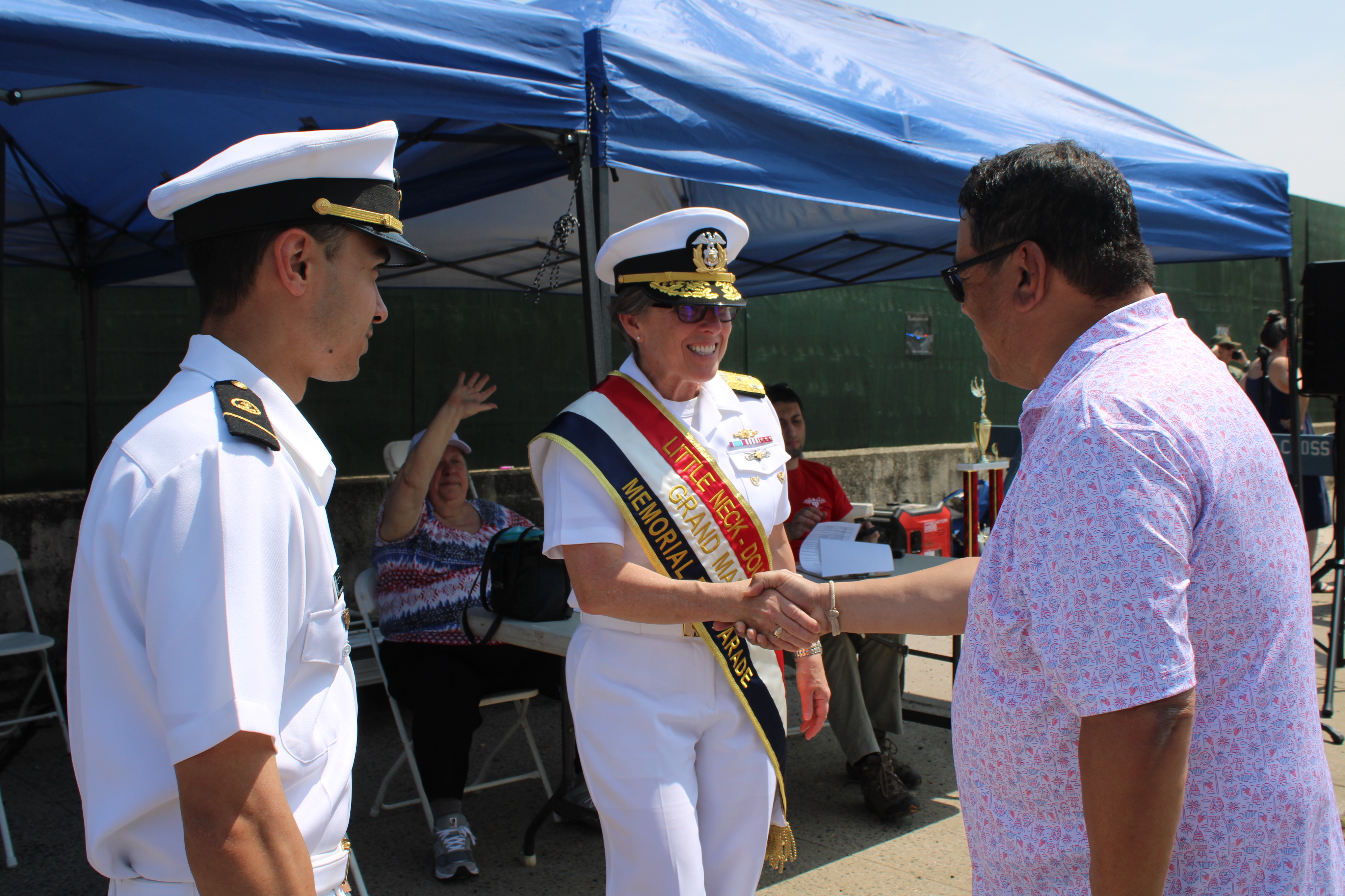Admiral Nunan is greeted by a midshipman and his father who was visiting from Arizona