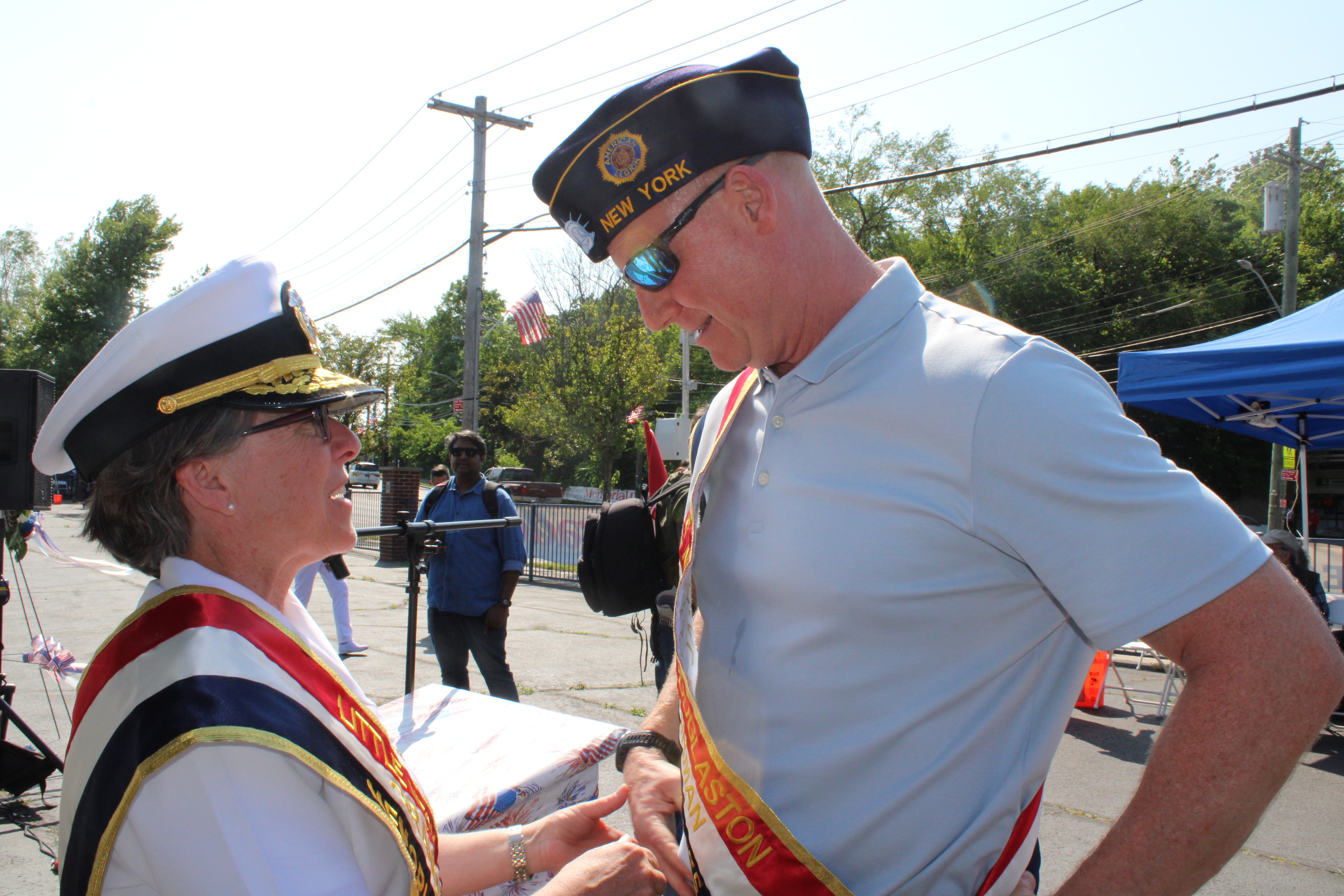 Admiral Nunan presents Parade Charman Tom Carty with a challenge coin