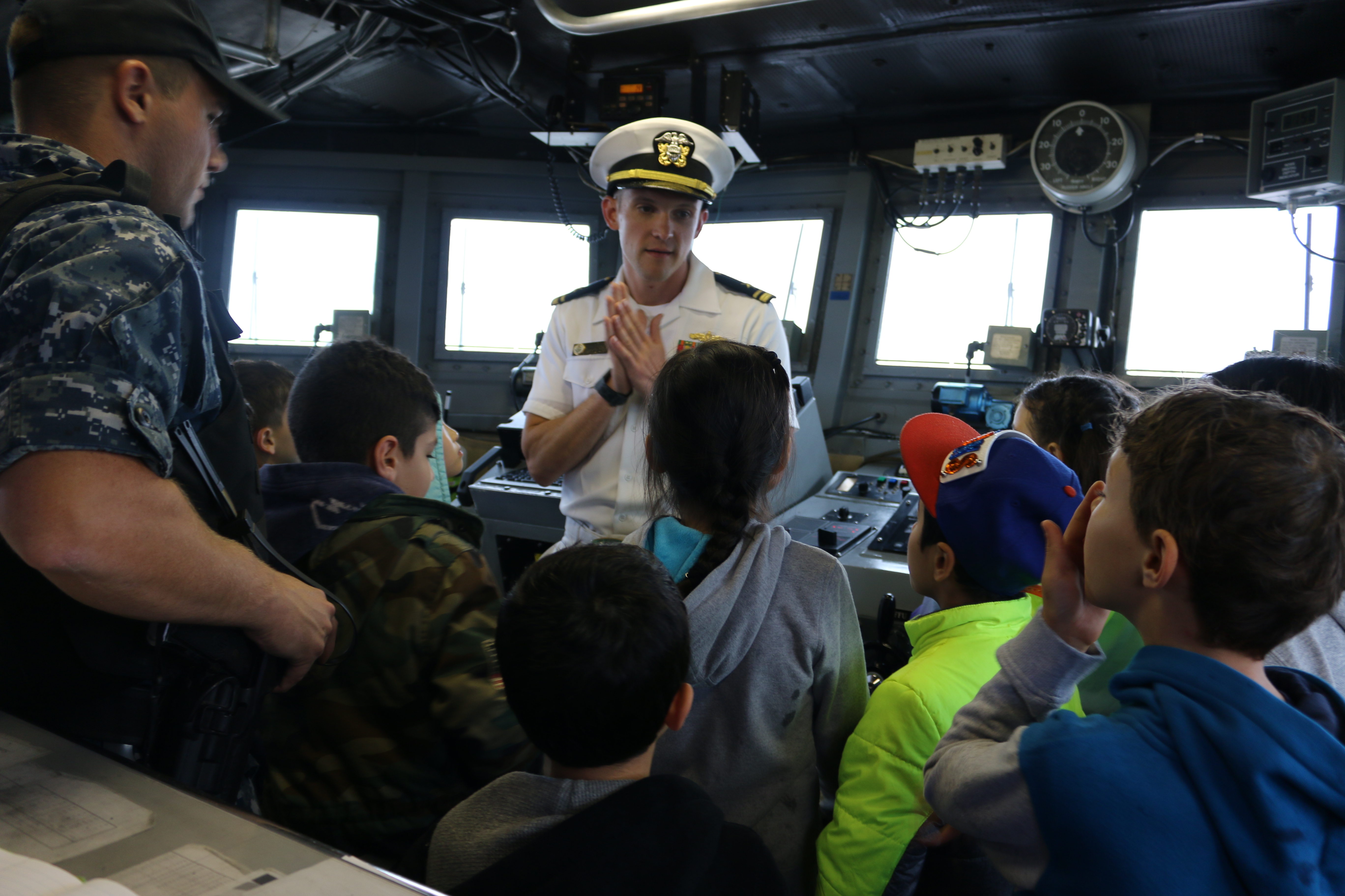 Local students on the bridge of the USS Zephyr