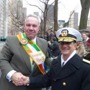 Parade Chairman, Mike Cassels greets RADM Helis