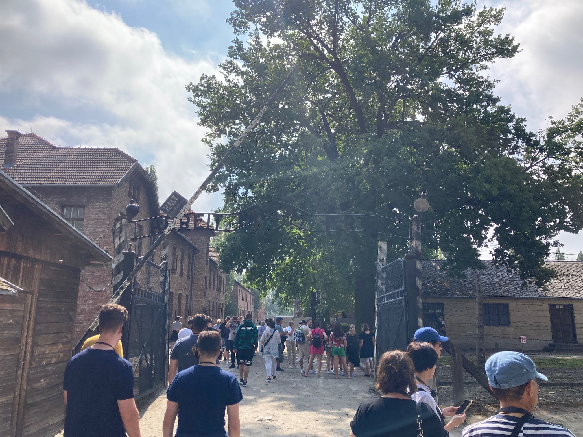 Students at the entrance to Auschwitz 1 entrance (Arbeit Macht Frei (Work Makes you Free) above the gate)