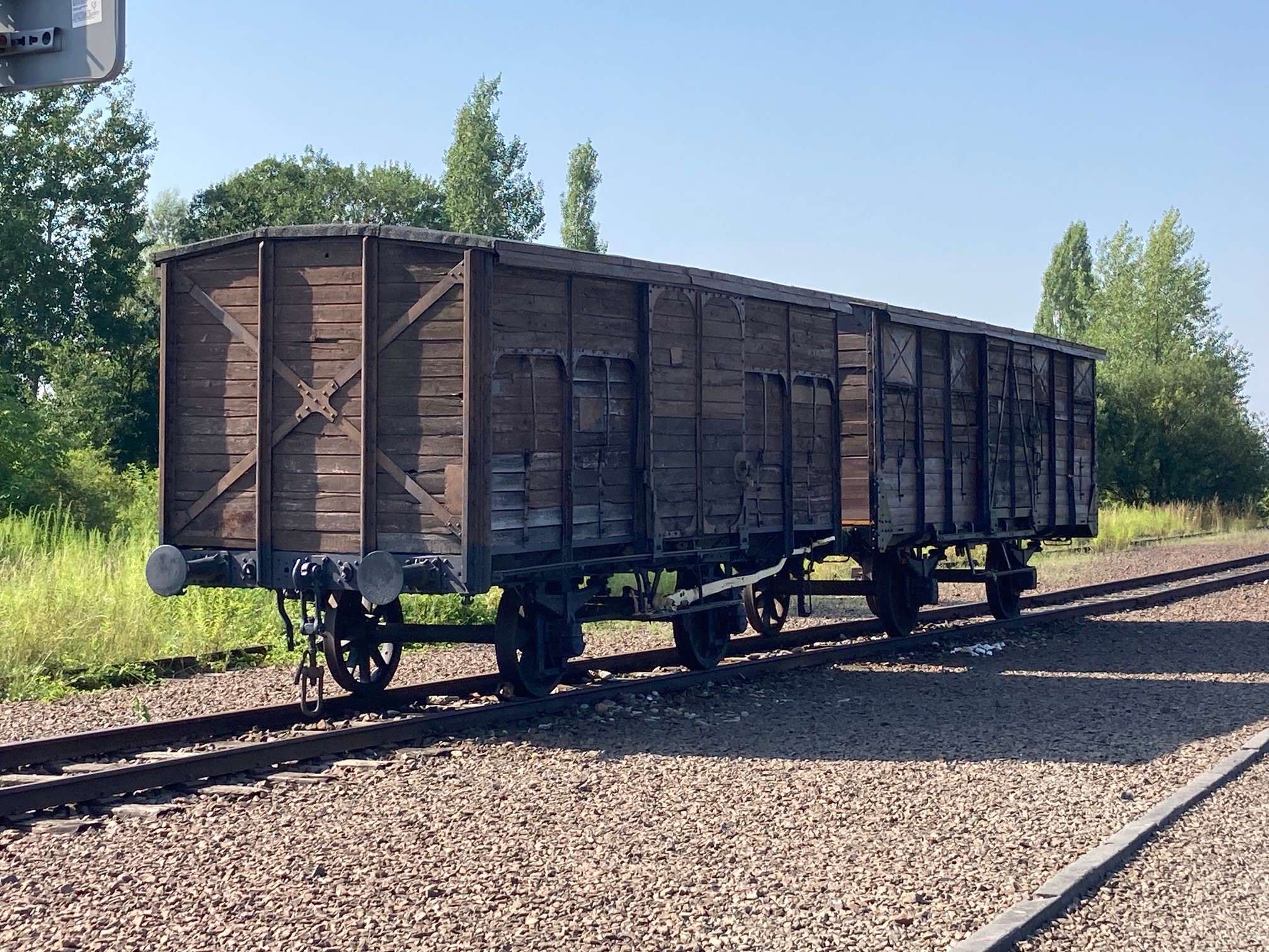 A period train car sits on the “Old Jewish Ramp” outside Auschwitz 2 Birkenau