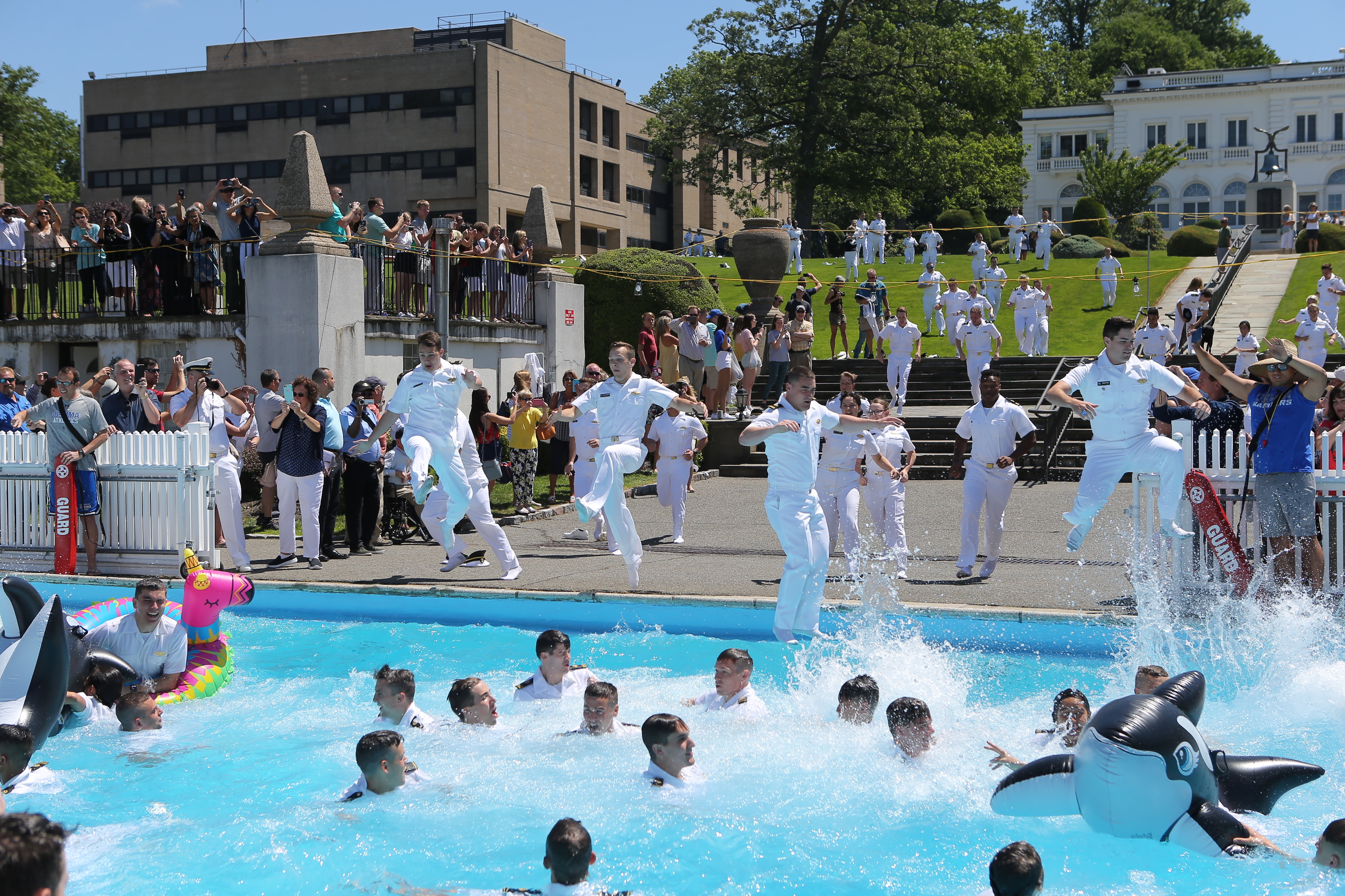 Midshipmen dive into Eldridge pool after Change of Command Ceremony