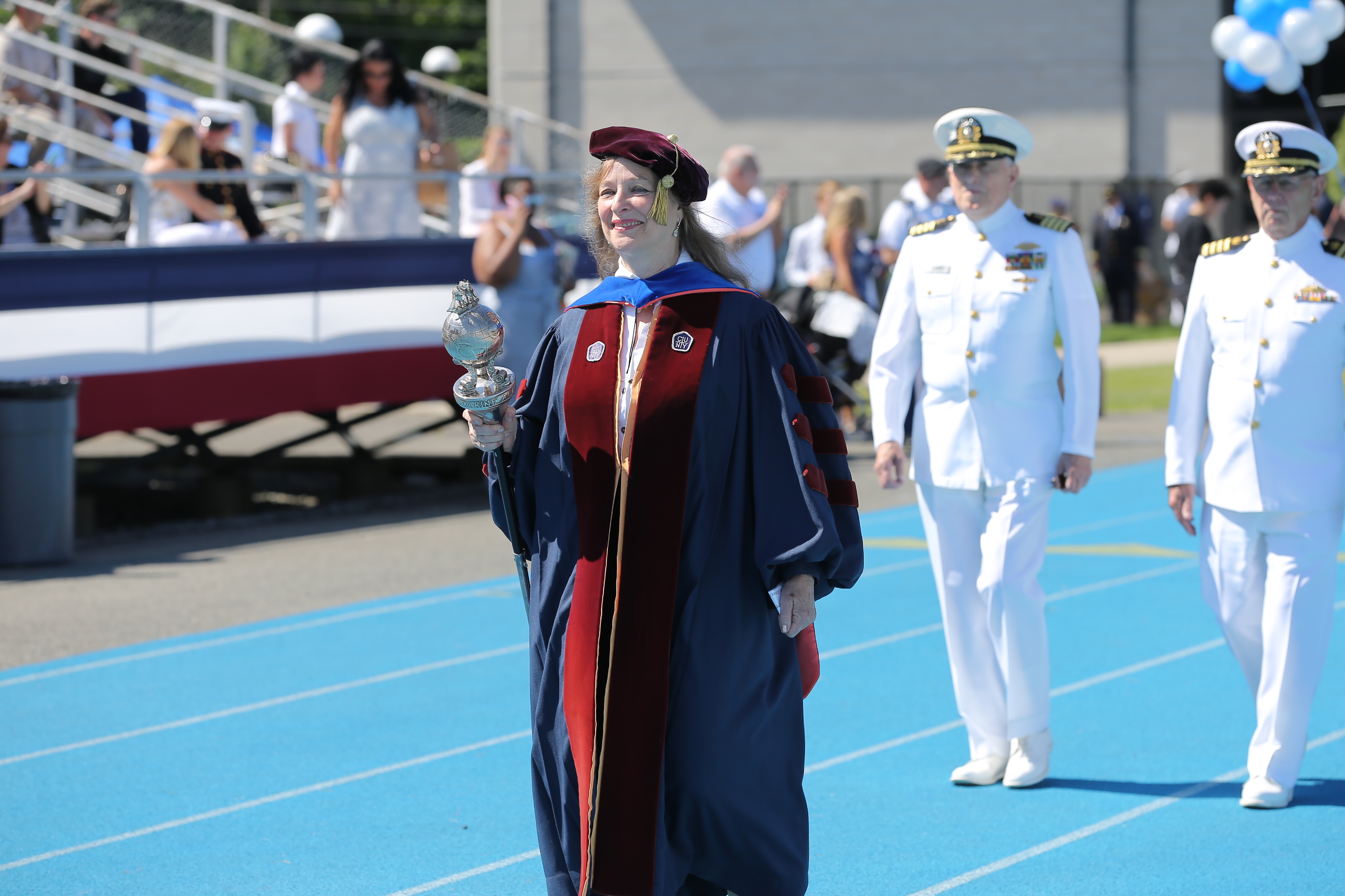 Dr. Magnus leads the faculty as USMMA's first woman mace bearer