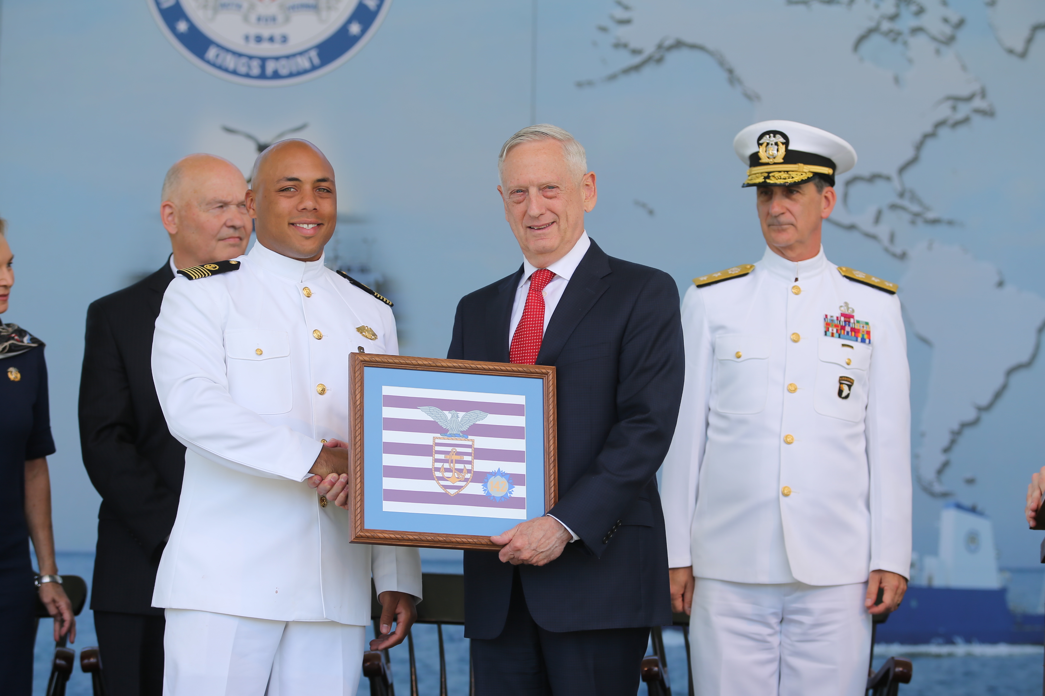 Former Regimental Commander and Mariners Quarterback, Brice Moore, presents Battle Standard to Secretary Mattis
