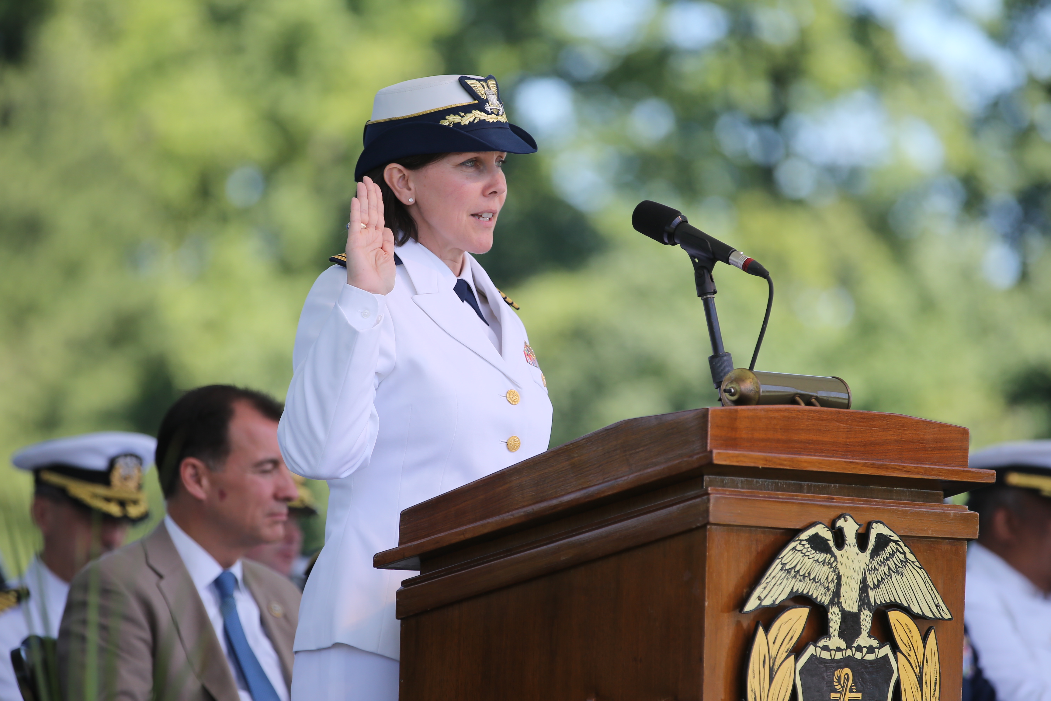Captain Jennifer Williams, '90 administers the USCG oath