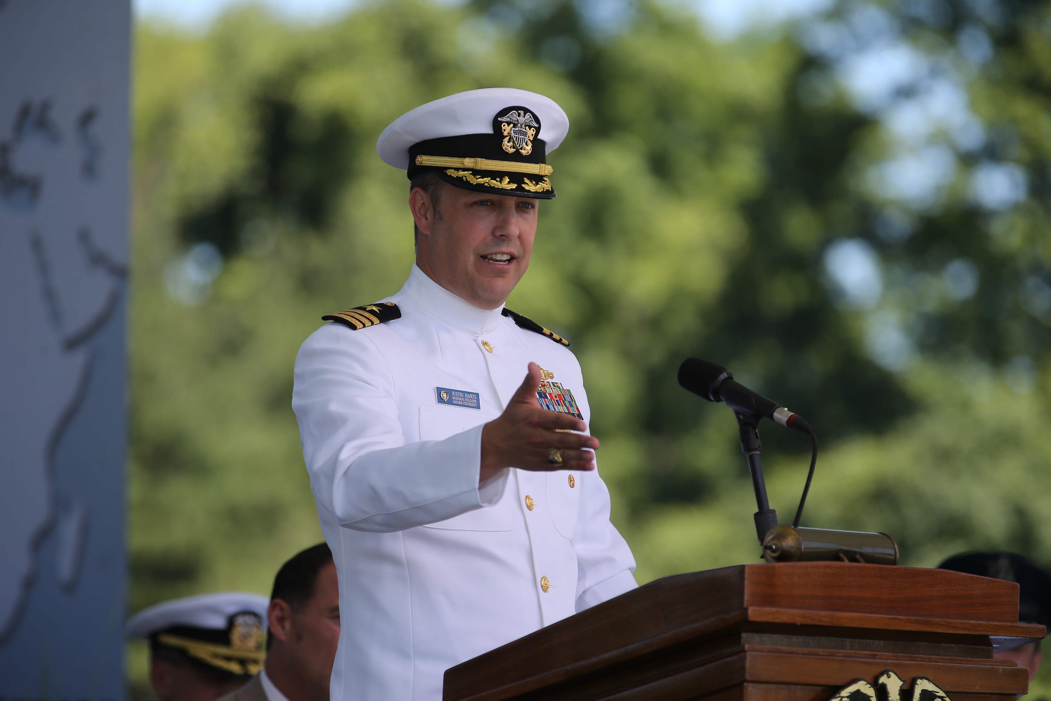 Captain (Sel) Justin Harts, '98 administers the Navy oath