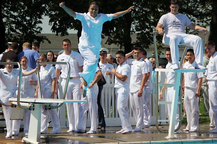 Midshipman jumps into pool from diving board