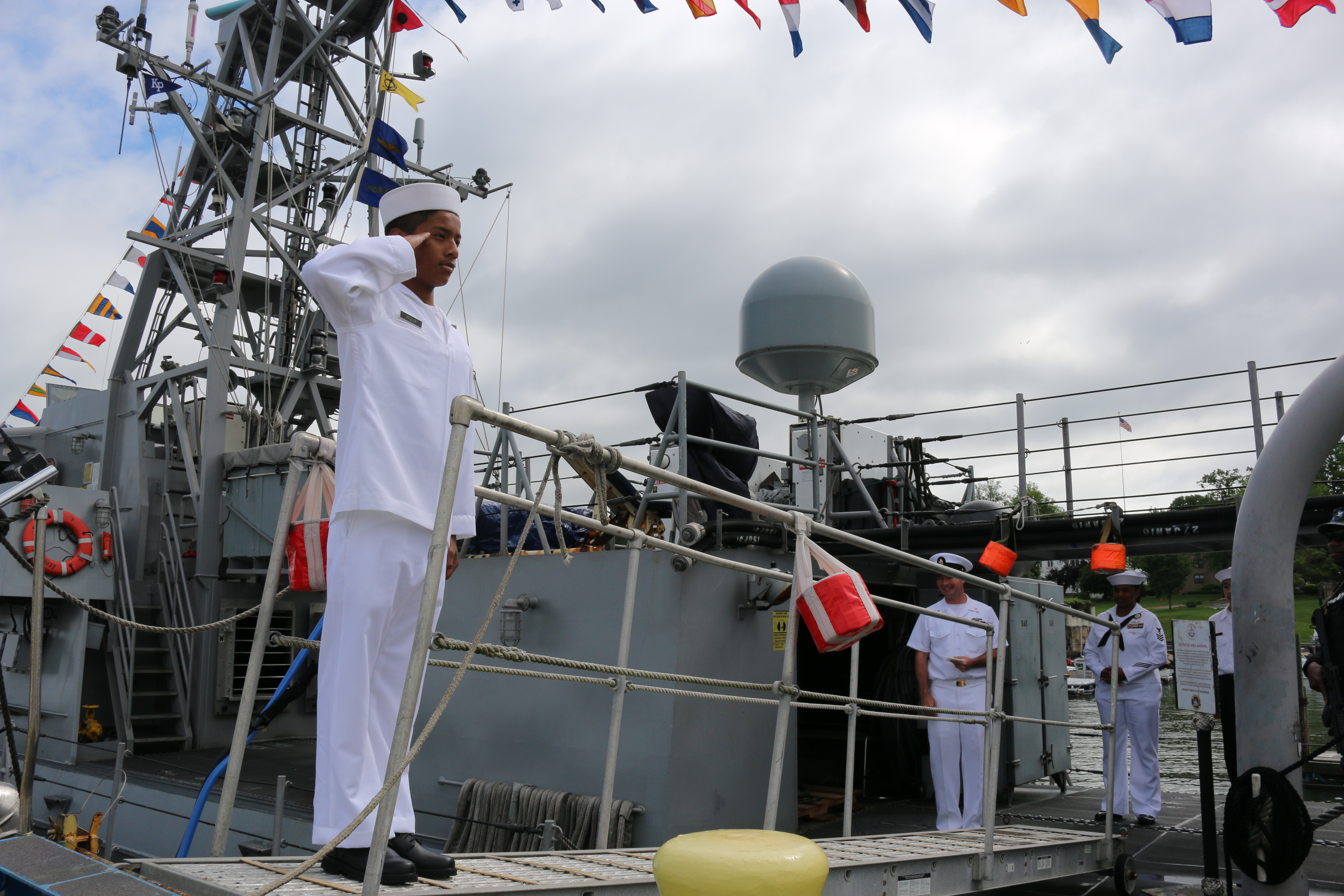 US Naval Sea Cadets (CPL Kyle Carpenter Division) salute before boarding USS Zephyr