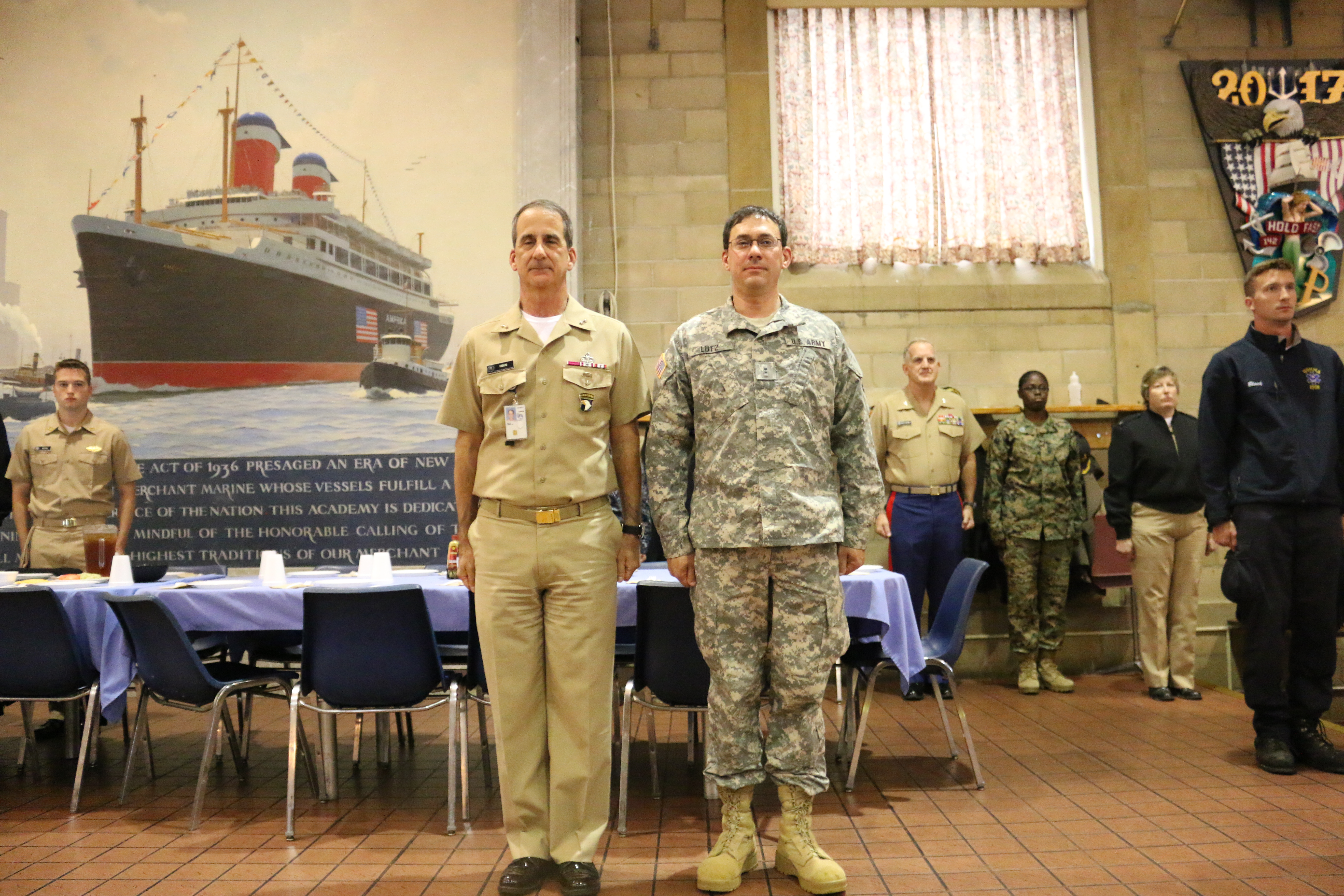 Army Veterans, RADM Helis and CDR John Lutz at attention during "As the Army Goes Rolling Along"