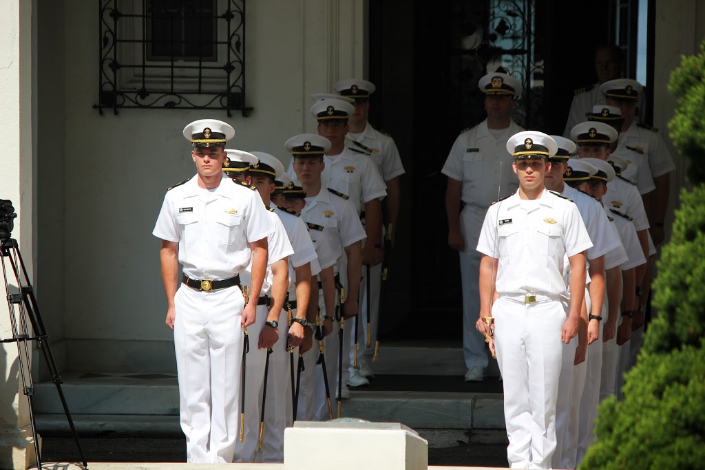 Midshipmen on the steps to Wiley Hall