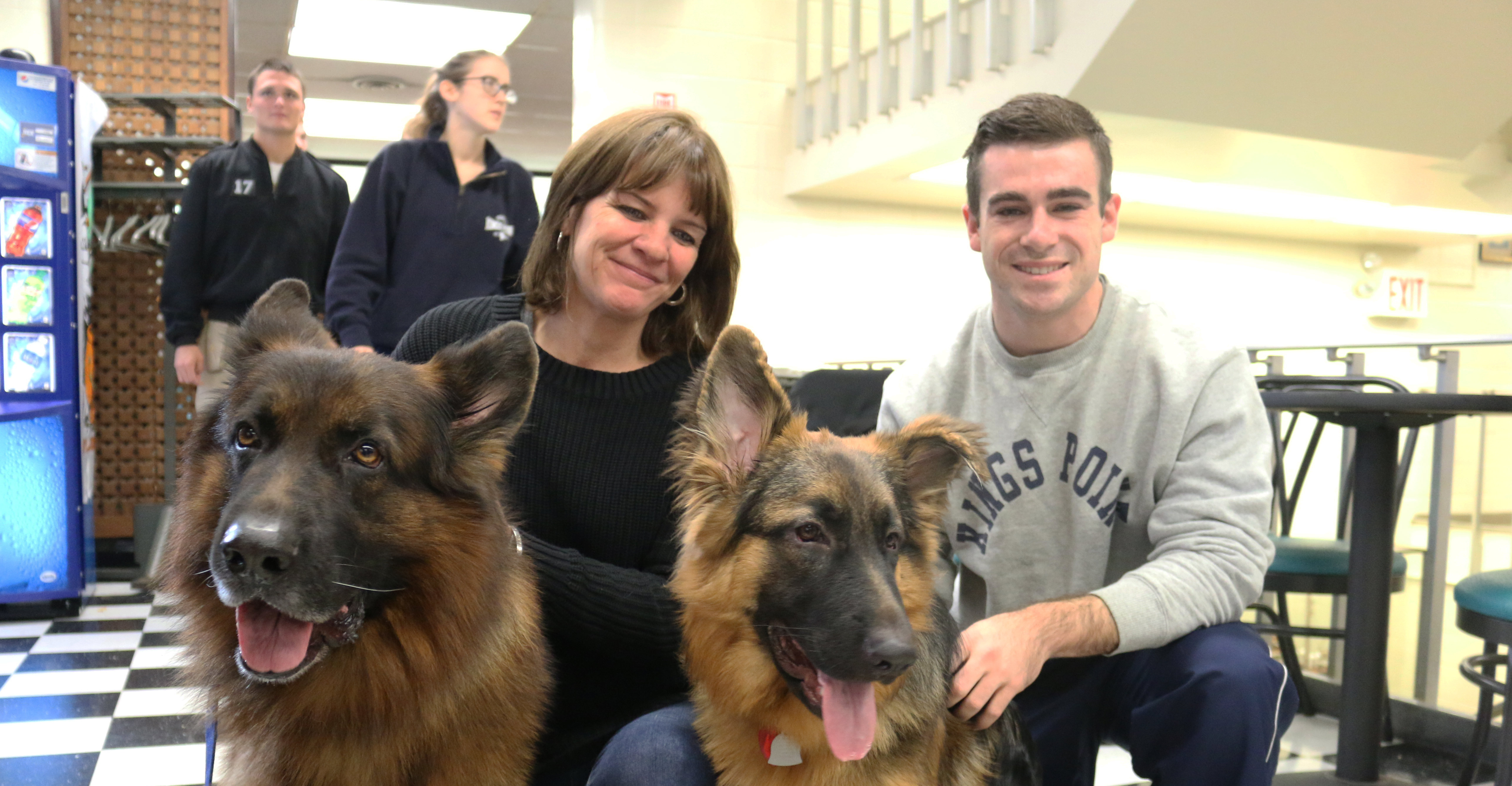 Kristin Papile LI Canine Class Therapy dog Team and MIDN Daniel Curry