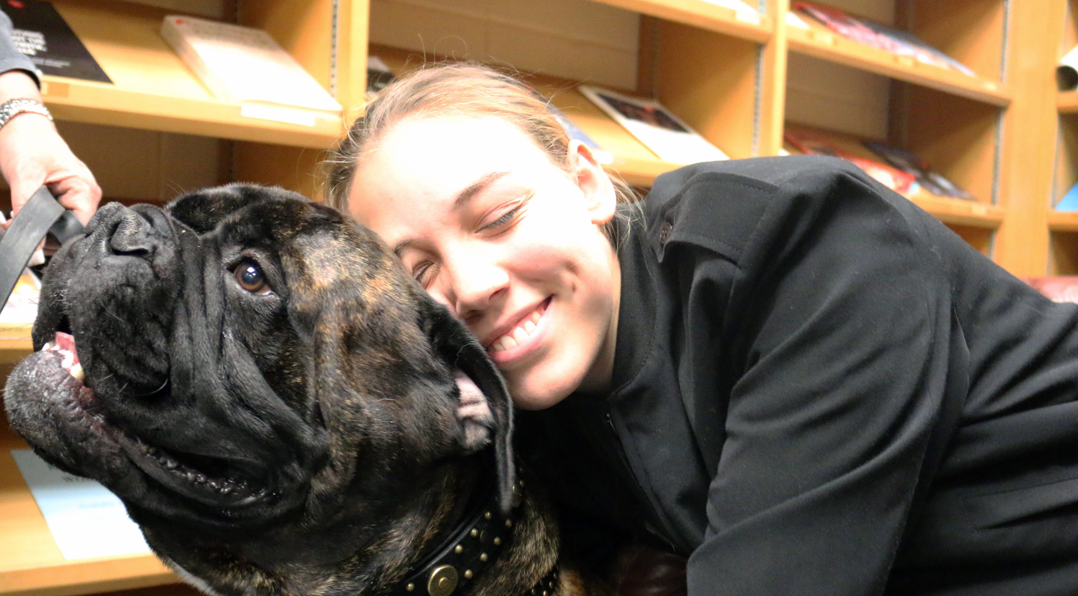 Plebe Ellen Carpenter shares a hug with Dante, the Bull Mastiff 27 OCT 2015