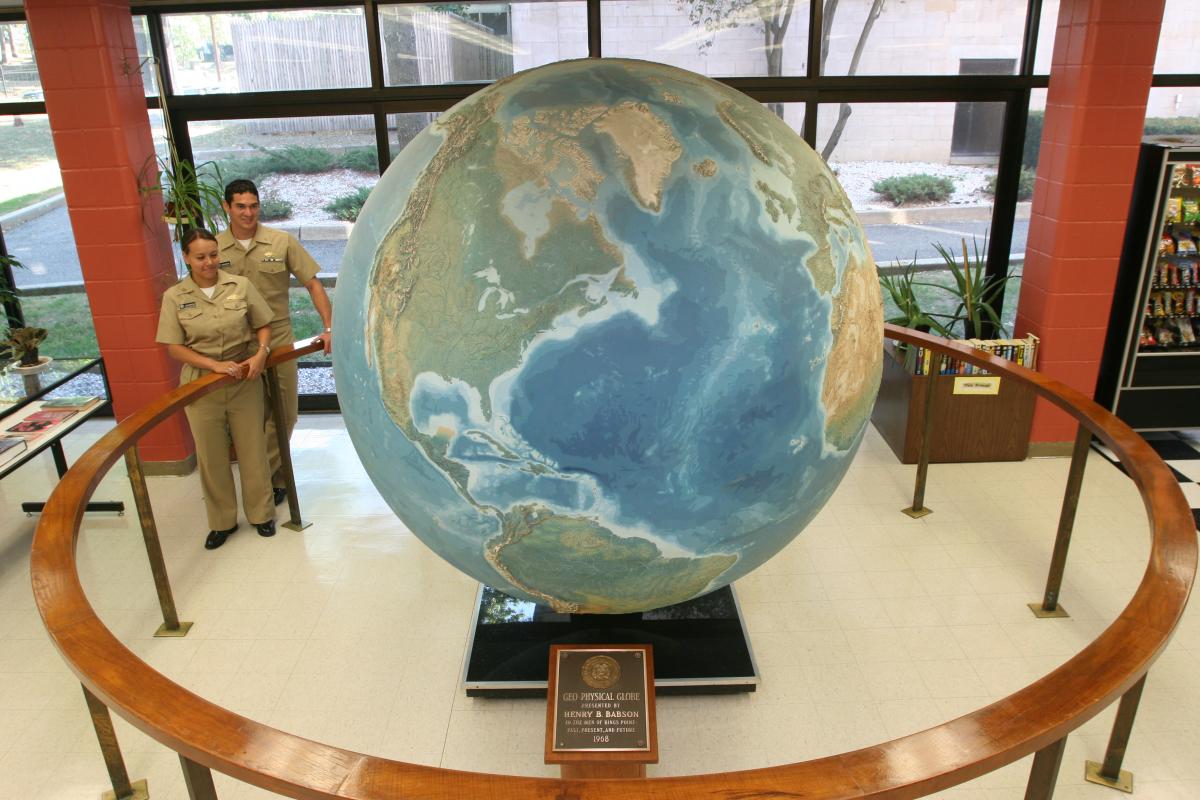 Midshipmen around Babson Globe.