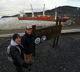 Midshipmen 2nd Class Nickolas Gioino and Midshipmen 2nd Class Tanner Evans with the MV Ocean Giant at McMurdo Station, Antarctic