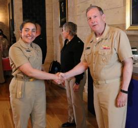 Rear Admiral Ballard congratulates Midshipman Morgan Fortin, 2c 