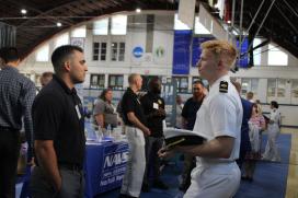 Andy Bouchot, '19 talking to potential Puget Sound Naval Shipyard candidates.