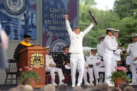 ENS Bueal Thomas George enthusiastically receives his degree and USCG License