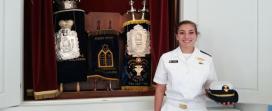 Midshipman 2nd Class Stacee Glass with the USMMA’s renovated Torah scrolls