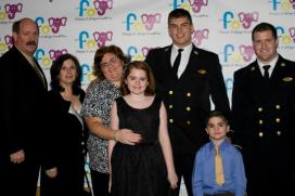 Coach Toop (left), Mikey and his family (middle) and teammates Midshipman Tobin and Midshipman Cameron at the "2013 Friends of Jaclyn Snowball"