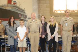 CAPT Palmer and family during award ceremony