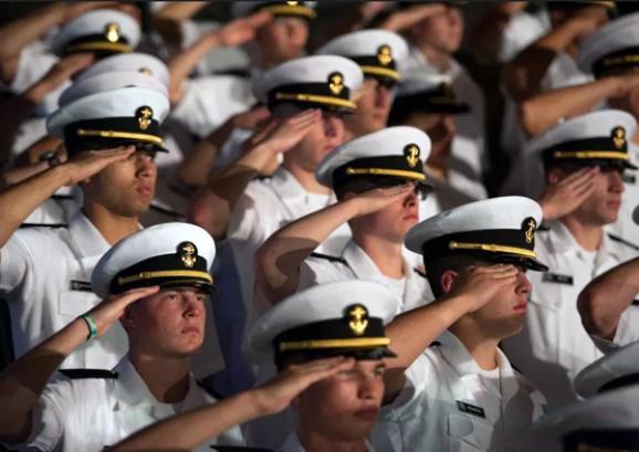 Midshipmen saluting